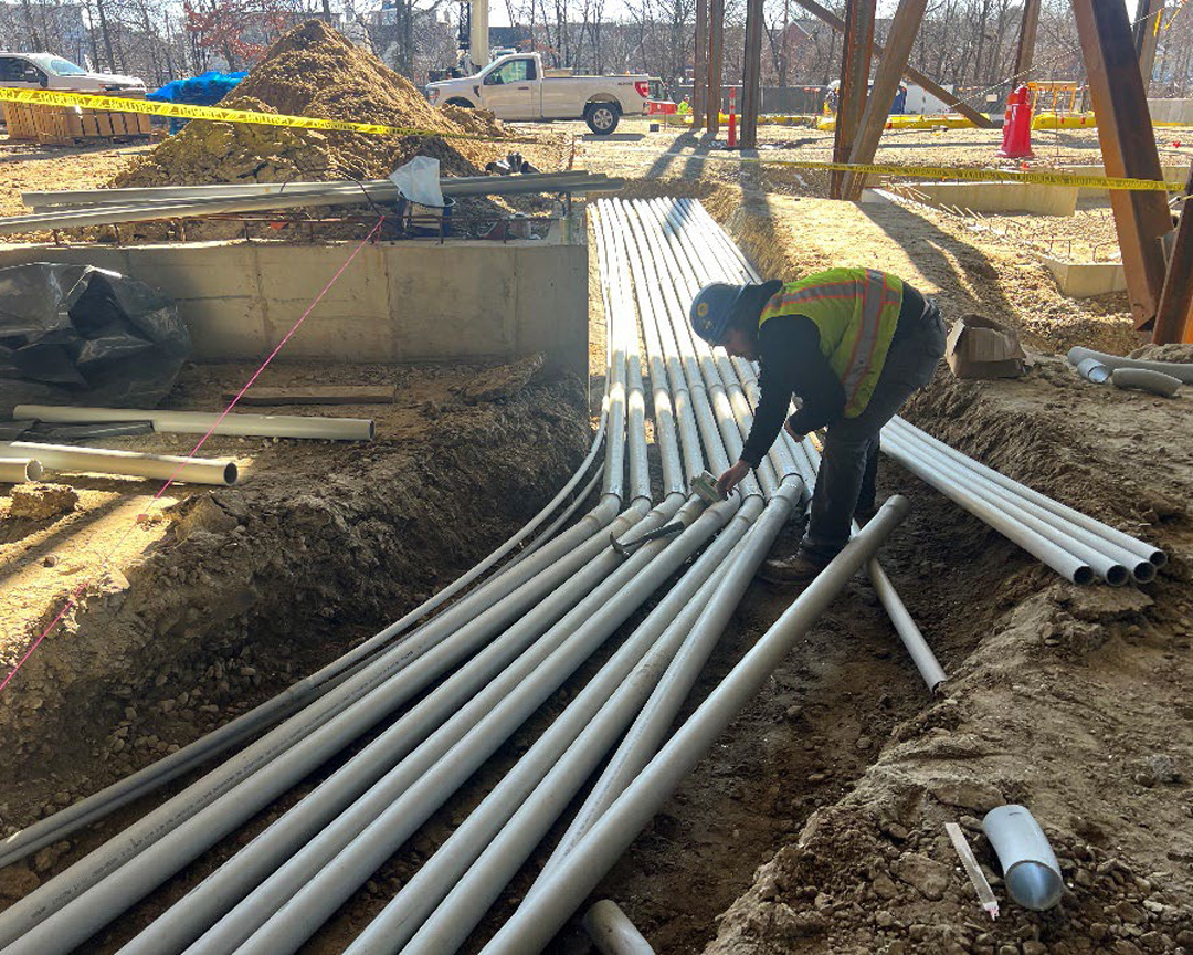 electrical conduit pipes laid in a big ditch